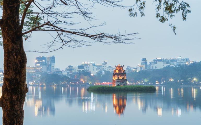 View of the illuminated Turtle Tower on Hoan Kiem Lake in Hanoi 
Image Credit: Linh Tran/Pexels