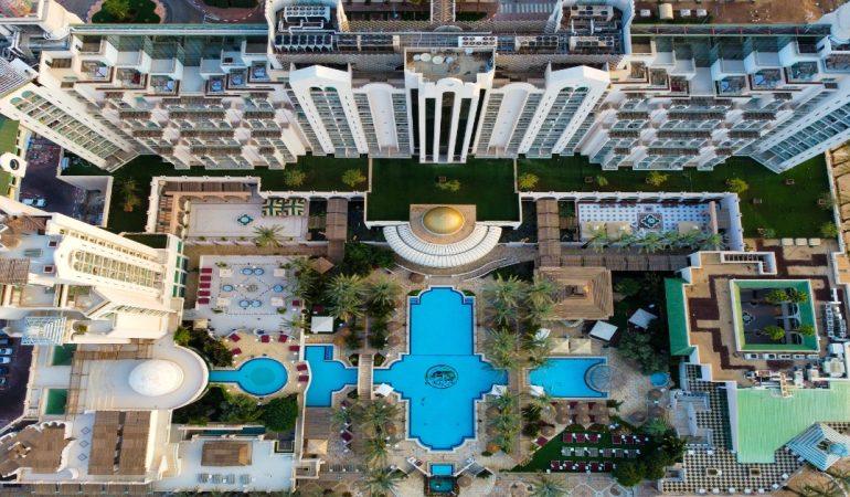 Luxury resort featuring a large swimming pool 
Image Credit: Lio Voo/Pexels