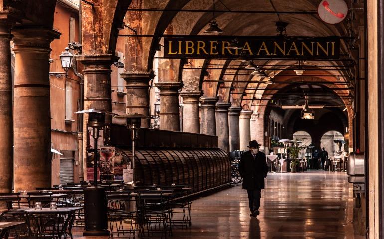 A man walks under the arches of Bologna's historic portico, Italy.
Image Credit: Maria Laura Catalogna/Pexels