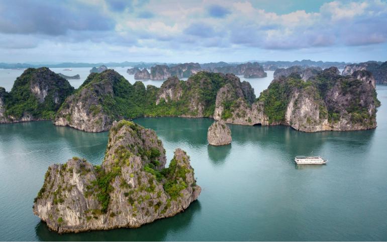 A breathtaking aerial shot of Ha Long Bay showcasing limestone rock formations and a cruise ship.
Image Credit: Quang Nguyen Vinh/Pexels