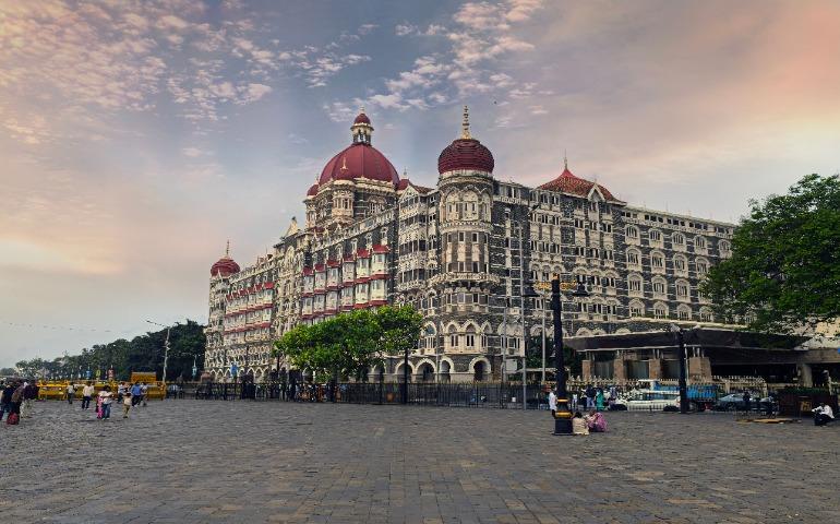 View of the iconic Taj Mahal Palace with a vibrant sky in Mumbai
Image Credit: AKJ S T U D I O/Pexels