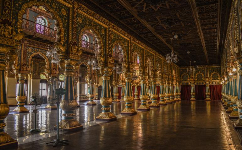 Magnificent interior view of Mysore Palace hall with ornate columns and intricate details.
Image Credit - Tanmoy Pal/Pexels