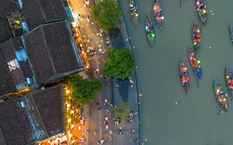 A stunning aerial view of Hội An's lantern-lit boats during twilight along the river.
Image Credit: Vietnam Hidden Light/Pexels