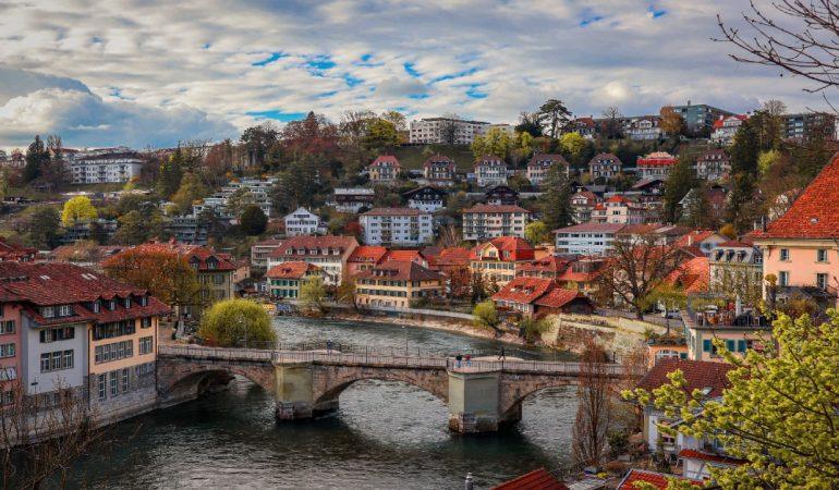View of Bern, Switzerland featuring the Nydeggbrücke bridge over the Aare River.
Image Credit: Vish Pix/Pexels