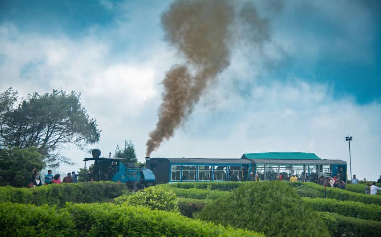 People enjoying riding in the toy train in Darjeeling