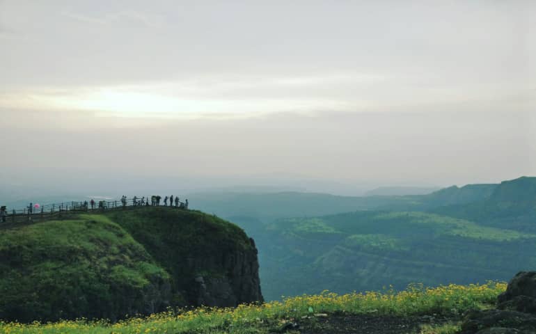 People standing on the cliff in Lonavala
