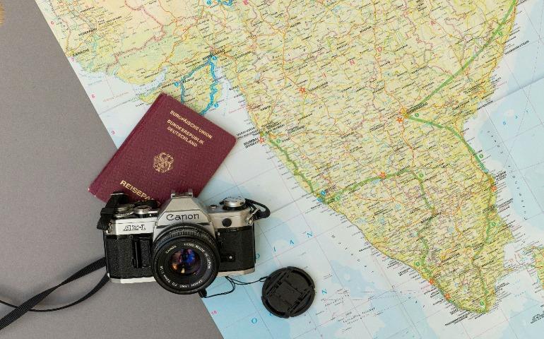 Map of India and a vintage 35mm camera.
Image Credit: Dennis Rochel/Unsplash