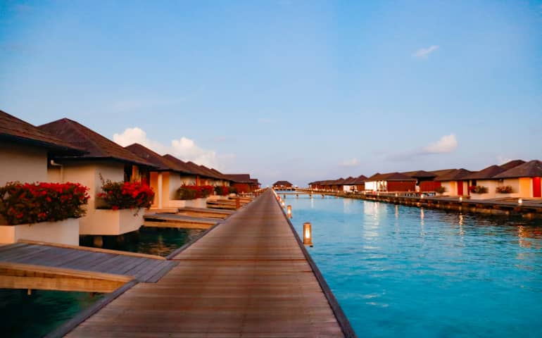 Tropical paradise with serene waters and stunning bungalows
