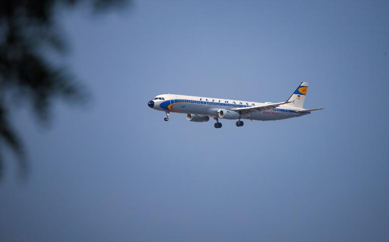A Lufthansa airplane flying against a clear blue sky, mid-flight and isolated.
Image Credit: Dante Juhasz/Pexels