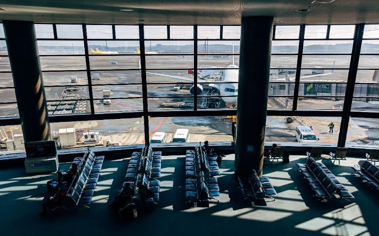 Spacious airport terminal with airplane
Image Credit: Markus Winkler/Pexels