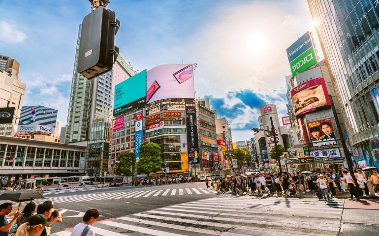 Tourists and pedestrians navigating Shibuya crossing, Tokyo Japan