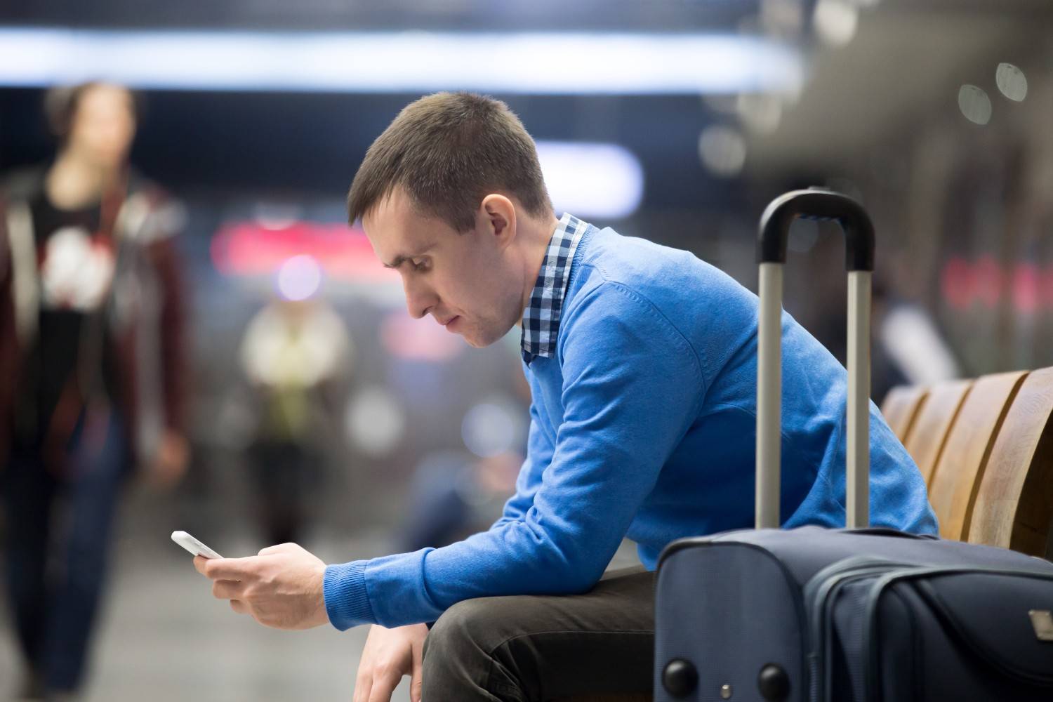 Traveller waiting at the airport for delayed baggage